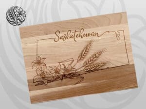 Saskatchewan signature cutting board made from Canadian maple with laser-engraved prairie lily and wheat design